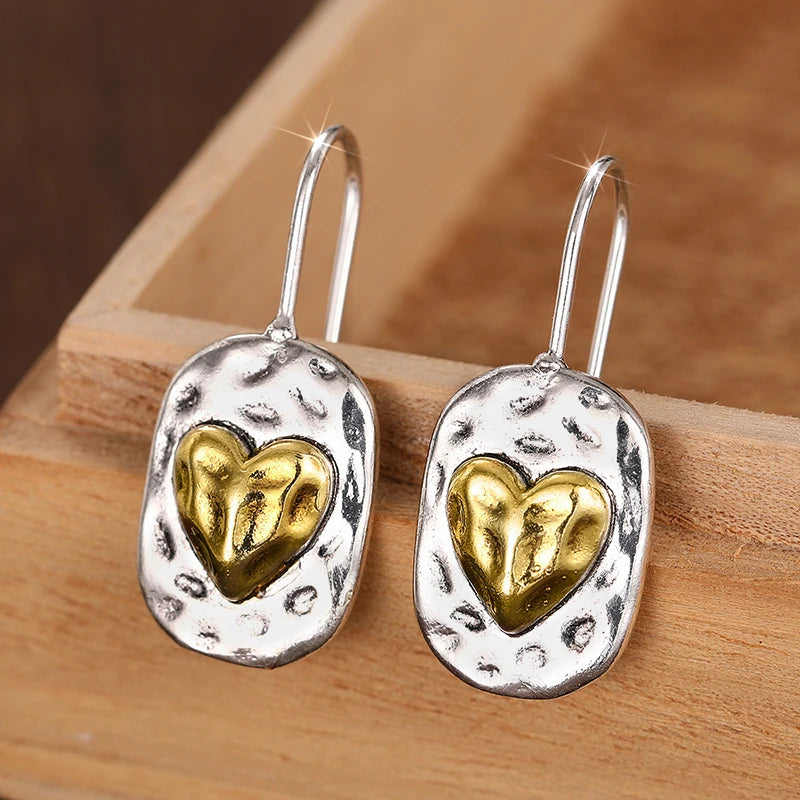 Boucles d'oreilles en cœur couleur argent et or