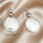 Boucles d'oreilles pendantes vintage en métal martelé