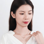 Κολιέ με διπλό μενταγιόν άπειρο και ζιργκόν ροζ χρυσό