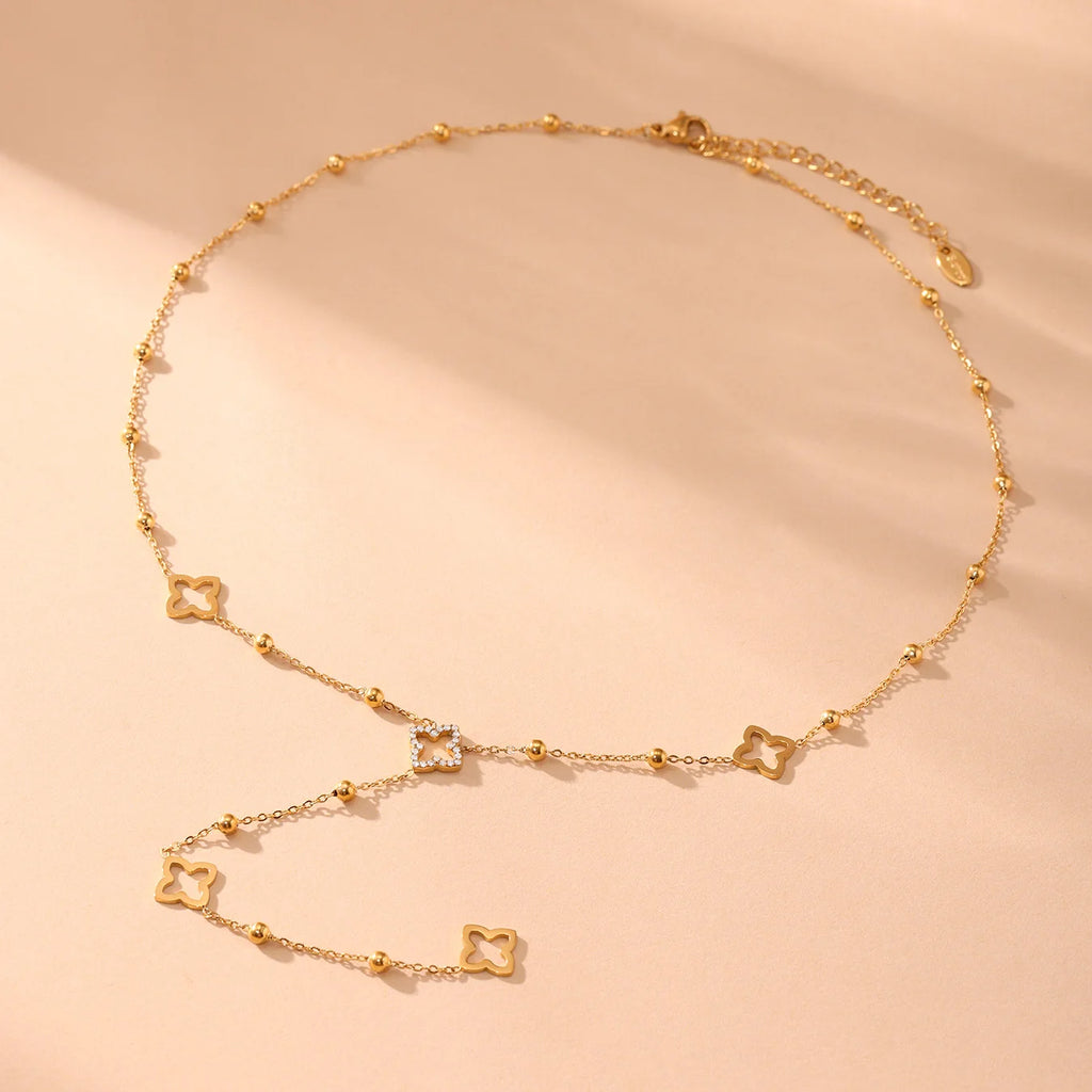 Μακρύ κολιέ με μενταγιόν τετράφυλλο τριφύλλι και ζιργκόν χρυσό