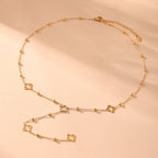 Μακρύ κολιέ με μενταγιόν τετράφυλλο τριφύλλι και ζιργκόν χρυσό