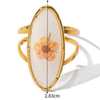 Μεγάλο δαχτυλίδι λουλούδι σε διαφανές πλαίσιο