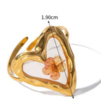 Μεγάλο δαχτυλίδι λουλούδι σε διαφανές πλαίσιο