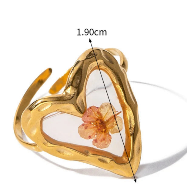 Μεγάλο δαχτυλίδι λουλούδι σε διαφανές πλαίσιο