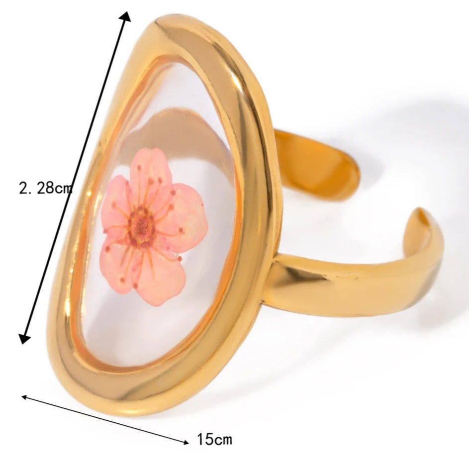 Μεγάλο δαχτυλίδι λουλούδι σε διαφανές πλαίσιο